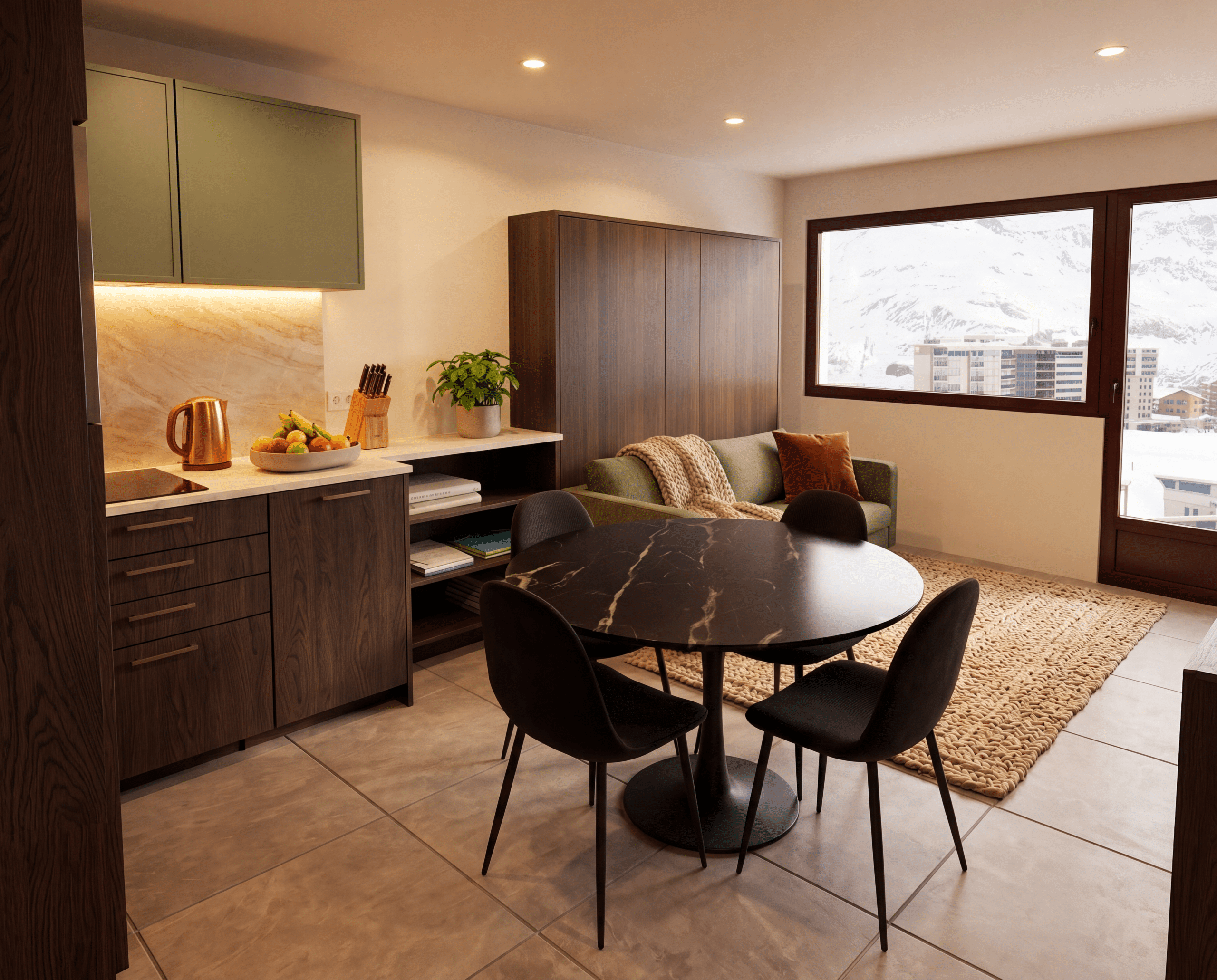 Appartement moderne avec salon-cuisine ouvert. Une table ronde noire marbrée et un canapé vert donnent sur une large fenêtre offrant une vue sur des montagnes enneigées.