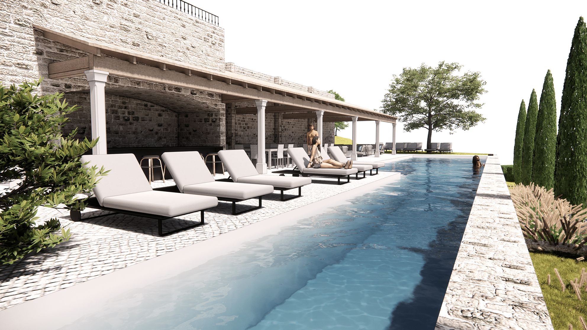 Une piscine extérieure de luxe longe un bâtiment en pierre avec terrasse ombragée. Des personnes se détendent sur des chaises longues et dans l'eau, entourées de verdure et d'arbres.