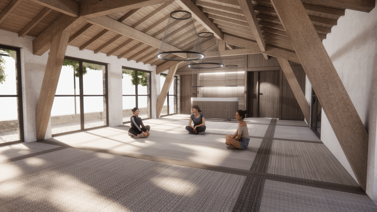 Trois femmes assises en tailleur conversent dans une vaste pièce lumineuse. Le contexte : un plafond en bois, de grandes baies vitrées donnant sur la verdure et un comptoir moderne.